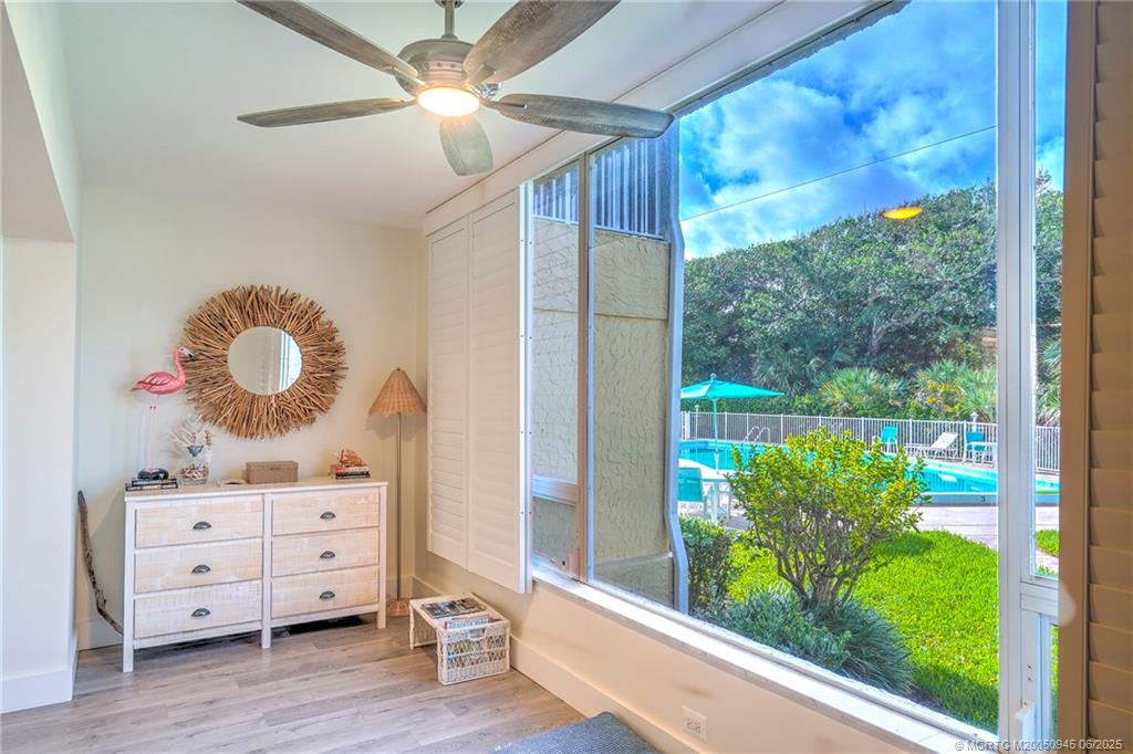 245 Northeast MacArthur Boulevard, Unit 11 Stuart, FL 34996 - Photo 18 of 47 a cabinet with window and wooden floor