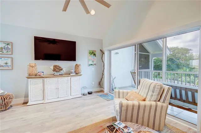 a bedroom with furniture and a flat screen tv