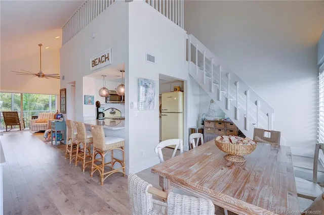 a view of livingroom and dining room with wooden floor