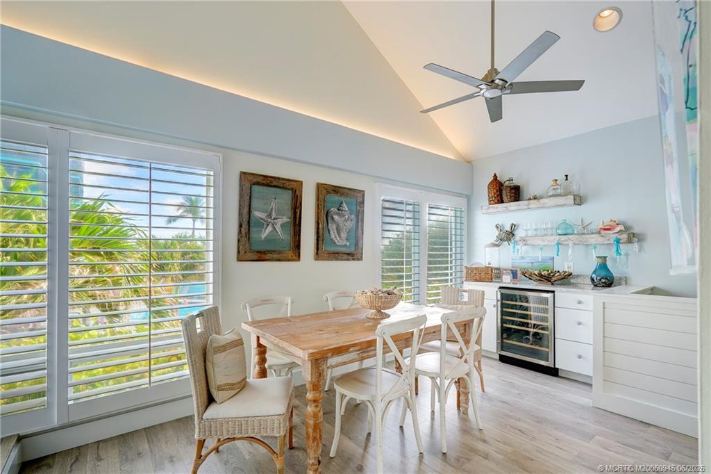 245 Northeast MacArthur Boulevard, Unit 11 Stuart, FL 34996 - Photo 31 of 47 a workspace with furniture window and wooden floor