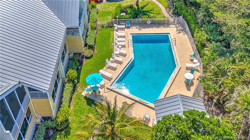 245 Northeast MacArthur Boulevard, Unit 11 Stuart, FL 34996 - Photo 42 of 47 an aerial view of a house with a garden
