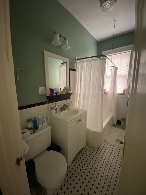 70 Strathmore Road, Unit 2B Boston, MA 02135 - Photo 7 of 7 a bathroom with a sink toilet and shower