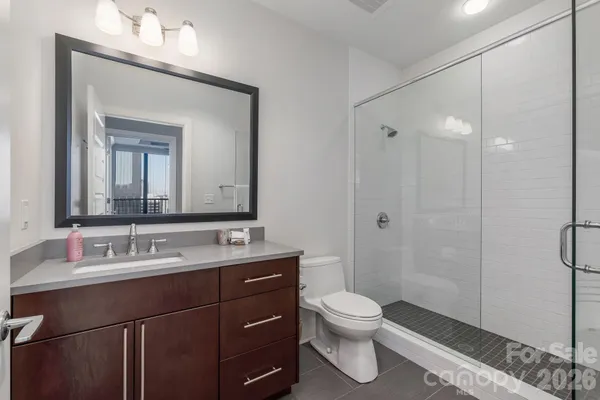 a bathroom with a toilet sink and shower