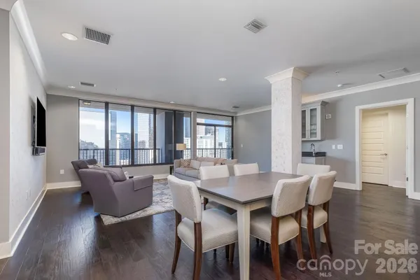 a view of a dining room with furniture window and wooden floor