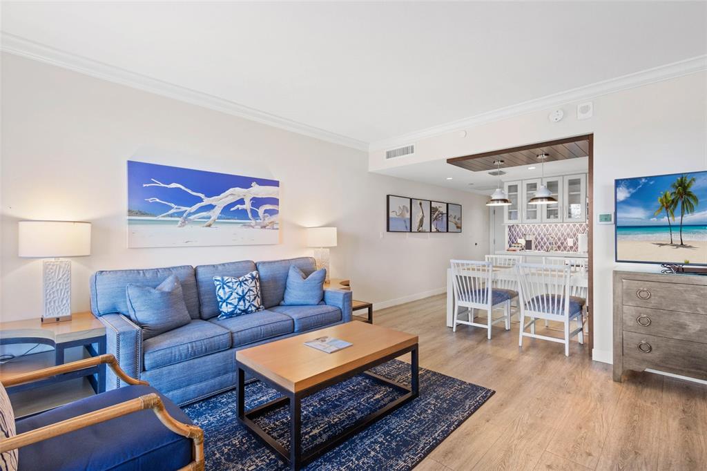 240 Sands Point Road, Unit 4104 Longboat Key, FL 34228 - Photo 10 of 47 a living room with furniture and a wooden floor