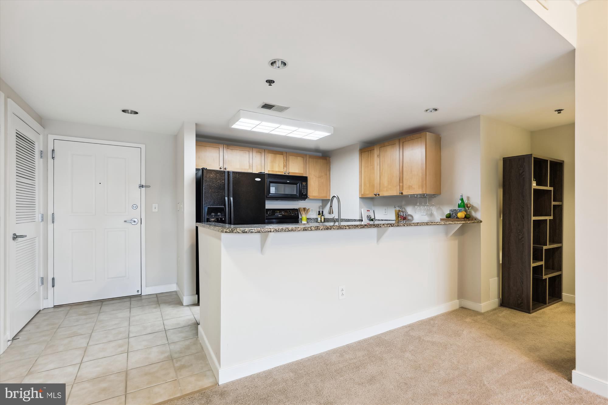 777 7th Street Northwest, Unit 804 Washington, DC 20001 - Photo 12 of 58 a view of kitchen with stainless steel appliances granite countertop a refrigerator and a sink