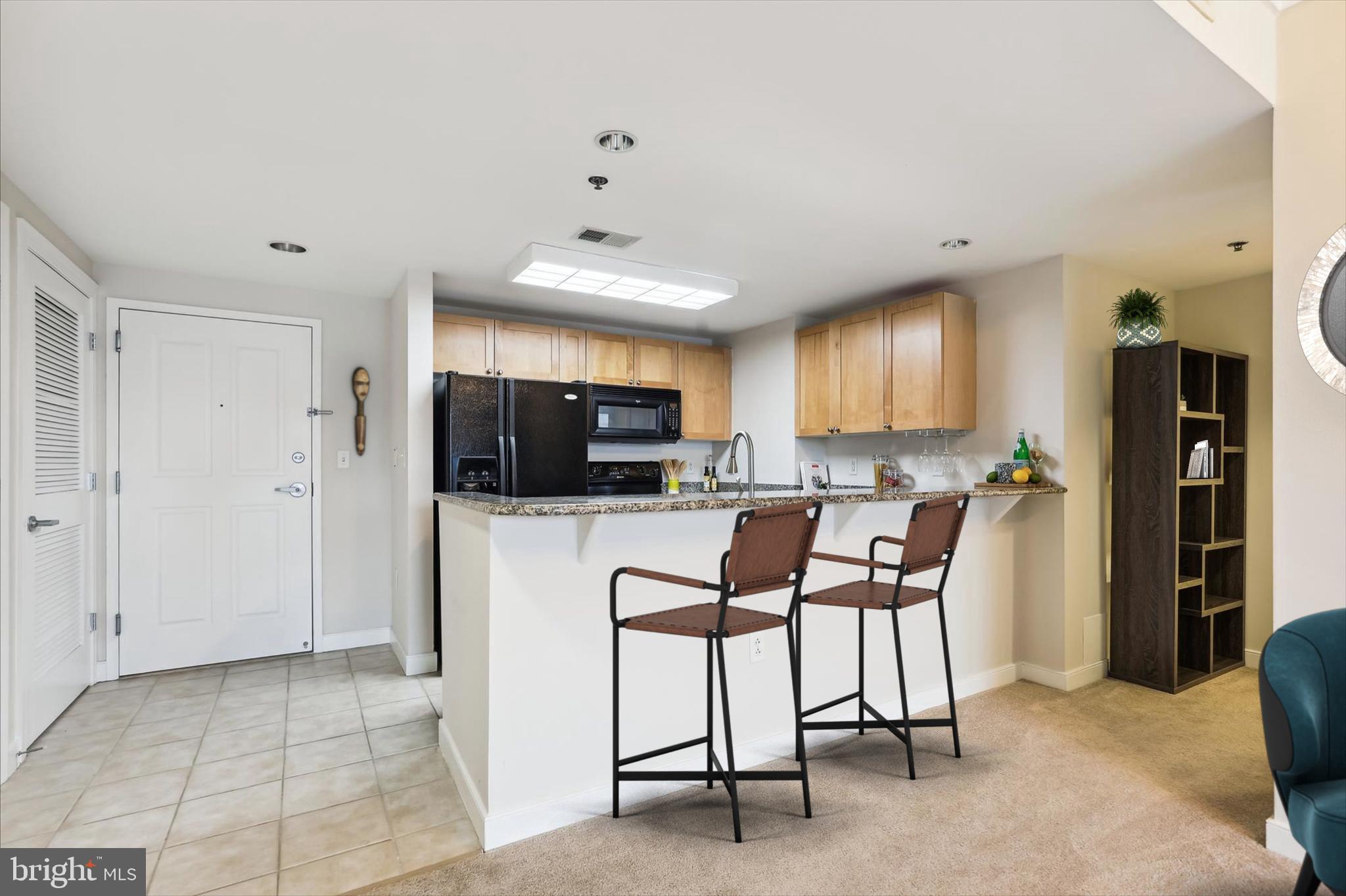 777 7th Street Northwest, Unit 804 Washington, DC 20001 - Photo 13 of 58 a view of a dining room with furniture and a kitchen