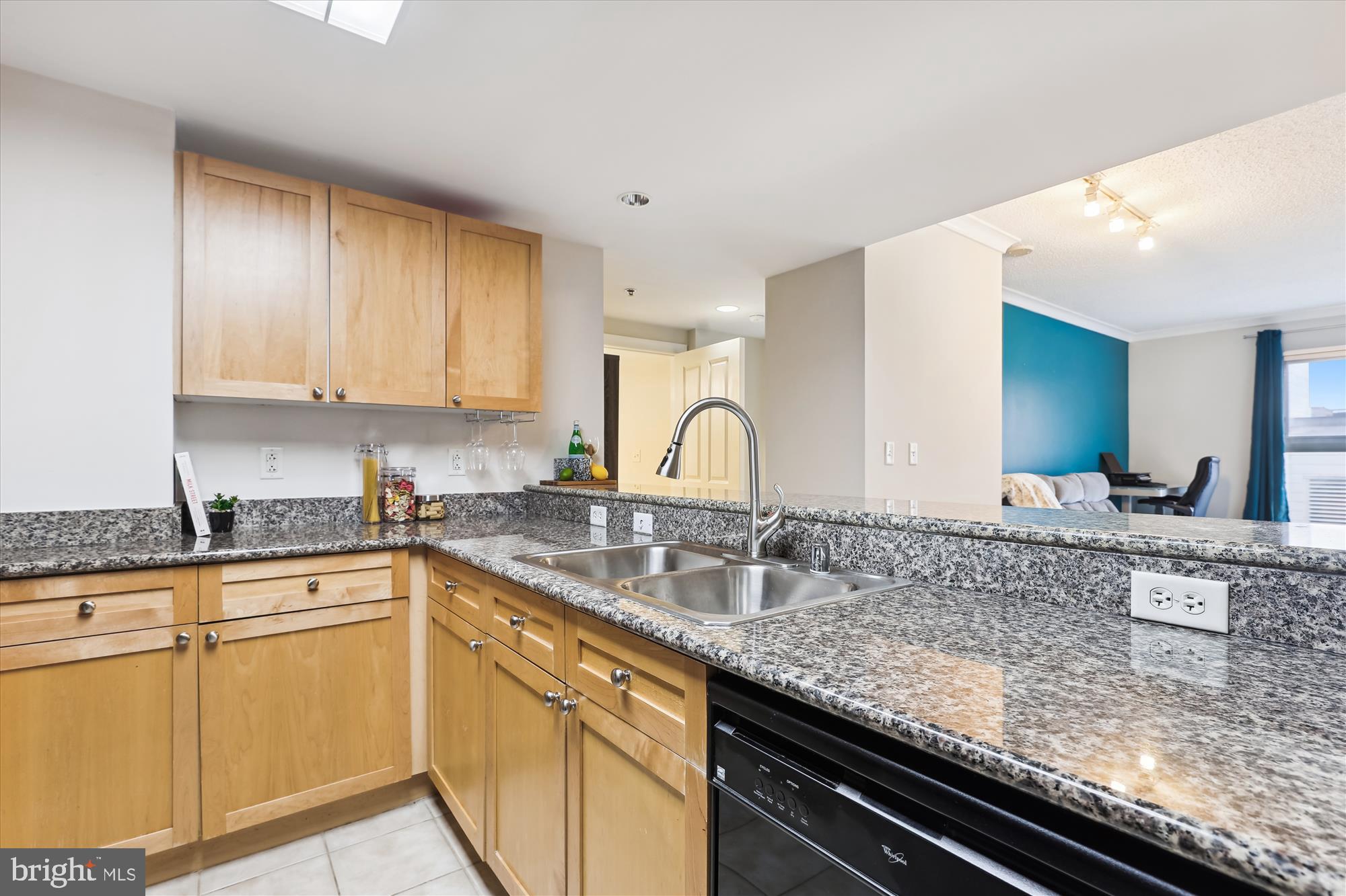 777 7th Street Northwest, Unit 804 Washington, DC 20001 - Photo 14 of 58 a kitchen with granite countertop a sink and cabinets