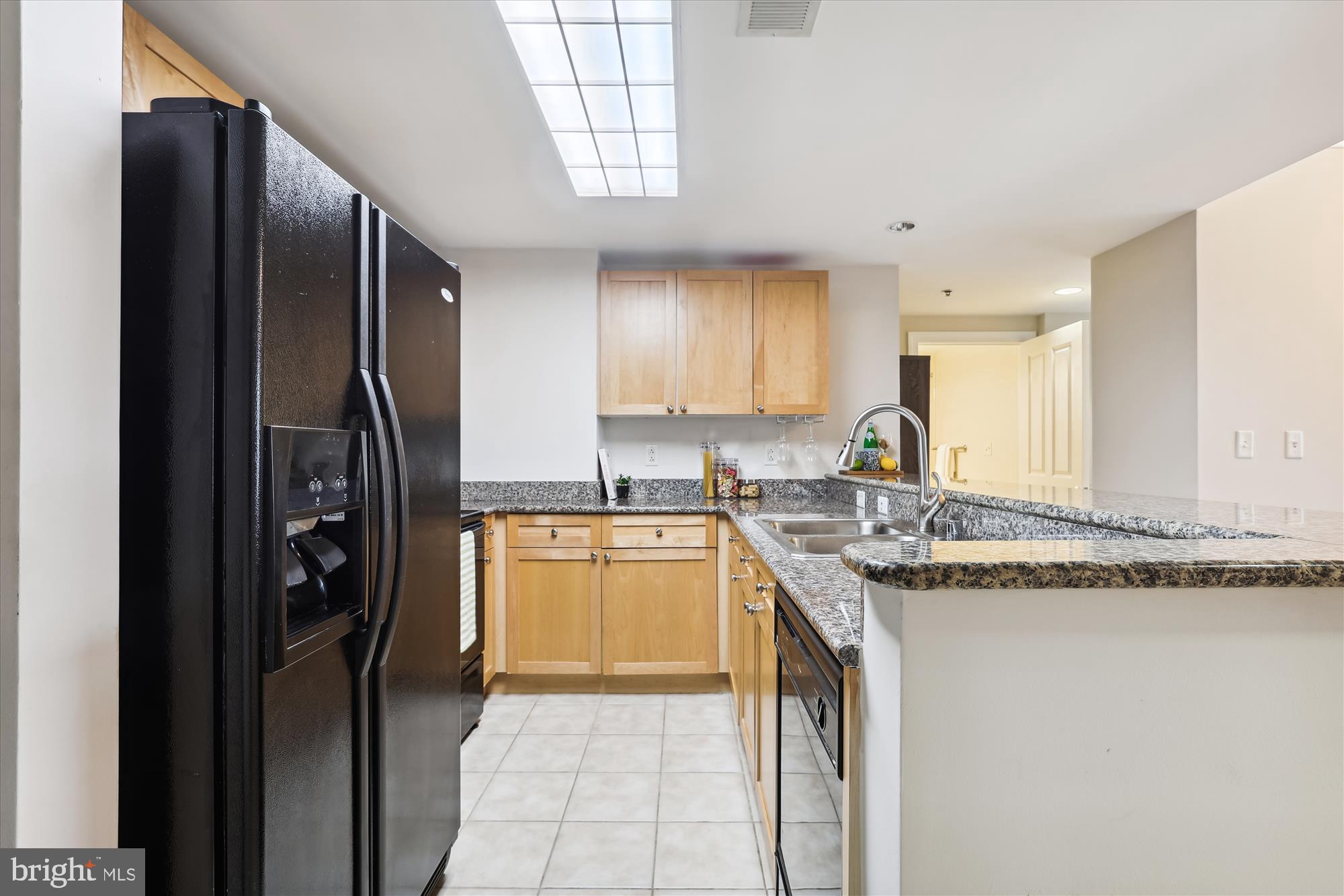 777 7th Street Northwest, Unit 804 Washington, DC 20001 - Photo 15 of 58 a kitchen with stainless steel appliances granite countertop a refrigerator and a sink