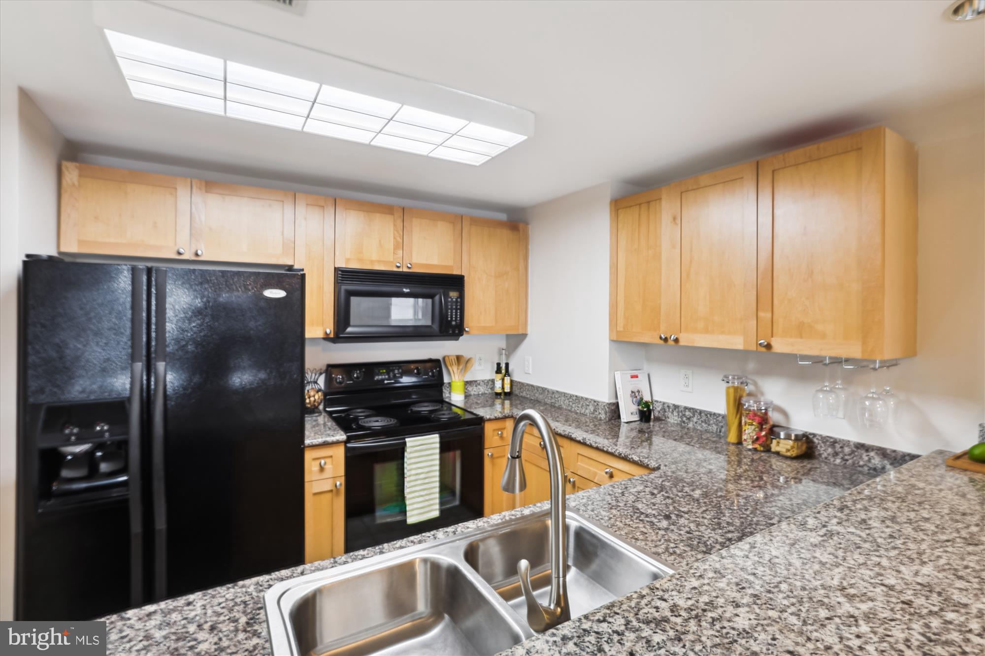 777 7th Street Northwest, Unit 804 Washington, DC 20001 - Photo 16 of 58 a kitchen with a refrigerator sink and stove