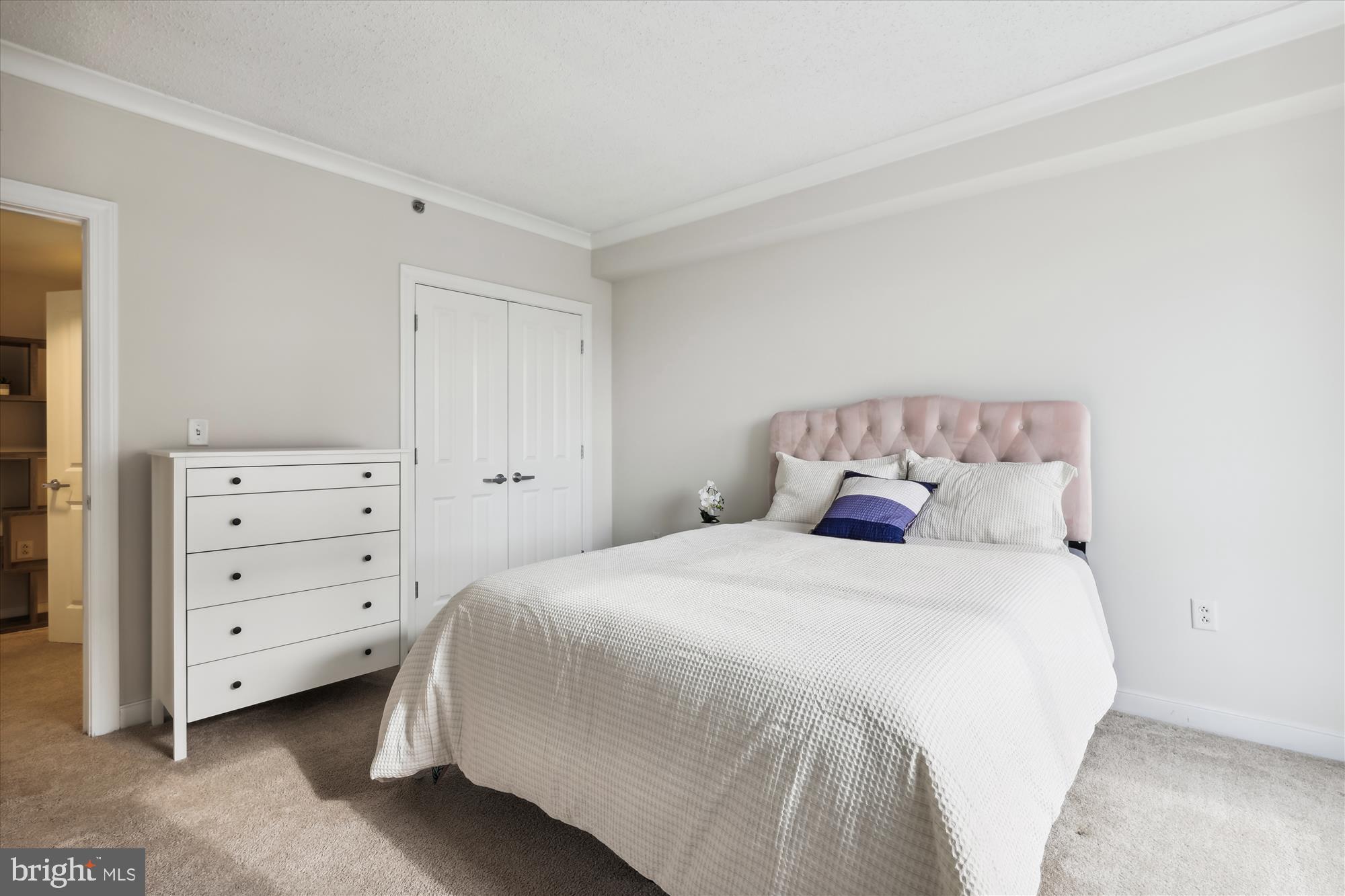 777 7th Street Northwest, Unit 804 Washington, DC 20001 - Photo 22 of 58 a bedroom with a bed and a dresser