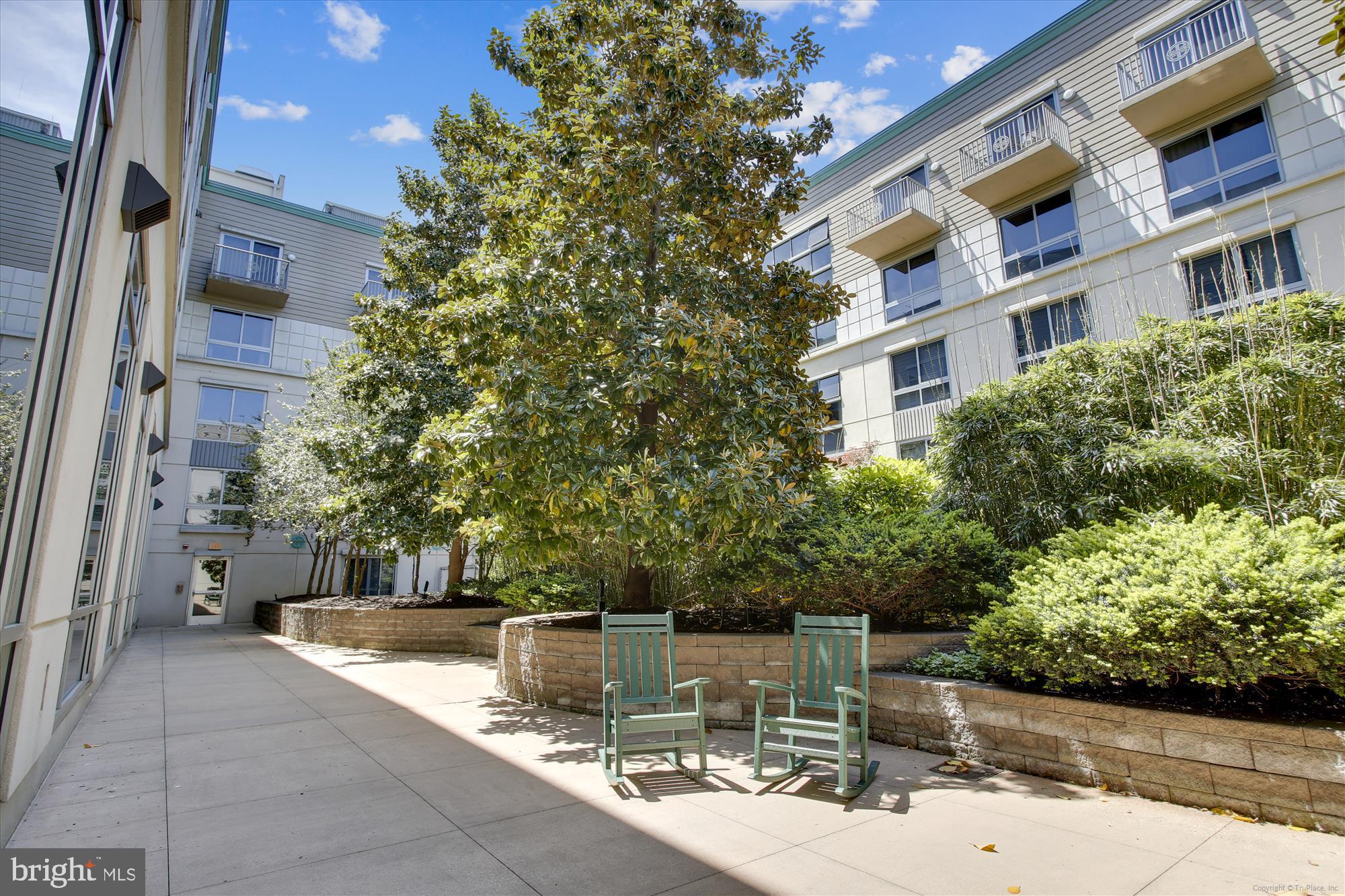 777 7th Street Northwest, Unit 804 Washington, DC 20001 - Photo 28 of 58 a view of a patio with couches and potted plants