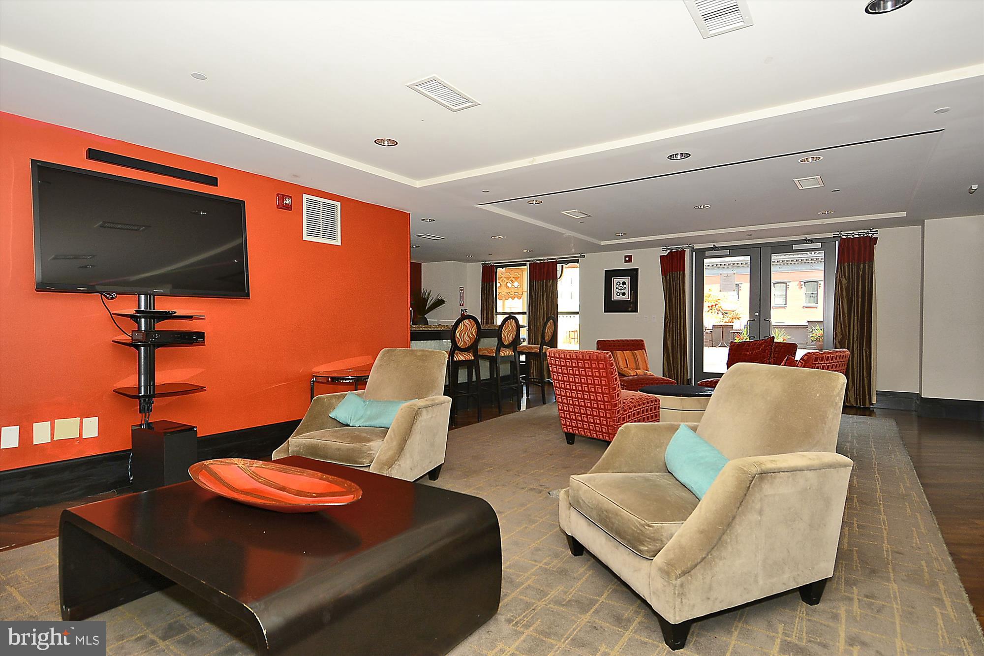 777 7th Street Northwest, Unit 804 Washington, DC 20001 - Photo 32 of 58 a living room with furniture and a flat screen tv