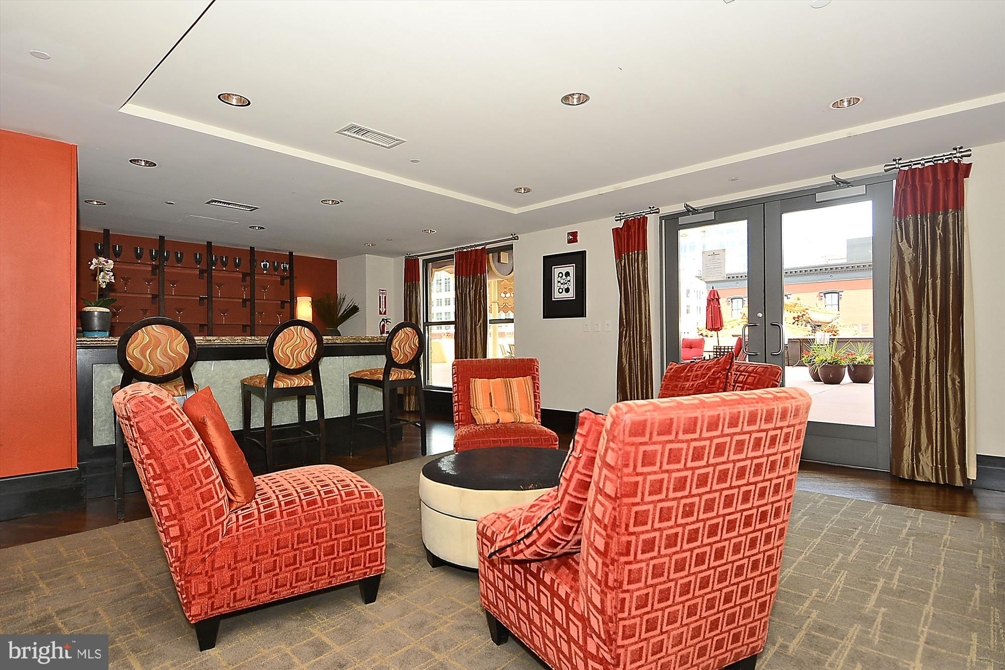 777 7th Street Northwest, Unit 804 Washington, DC 20001 - Photo 34 of 58 a living room with furniture a rug and a large window