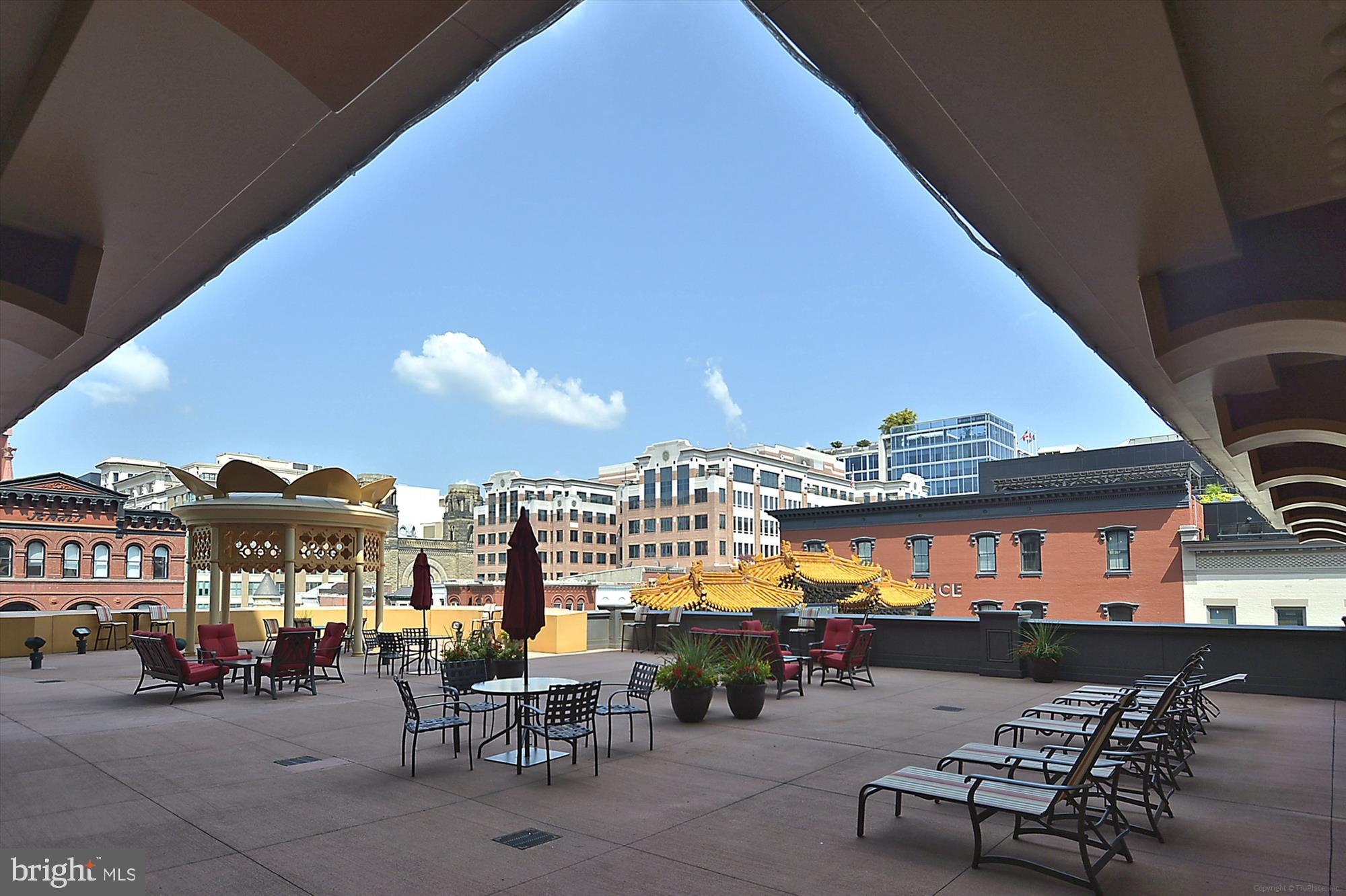 777 7th Street Northwest, Unit 804 Washington, DC 20001 - Photo 38 of 58 a view of a patio with chairs and tables