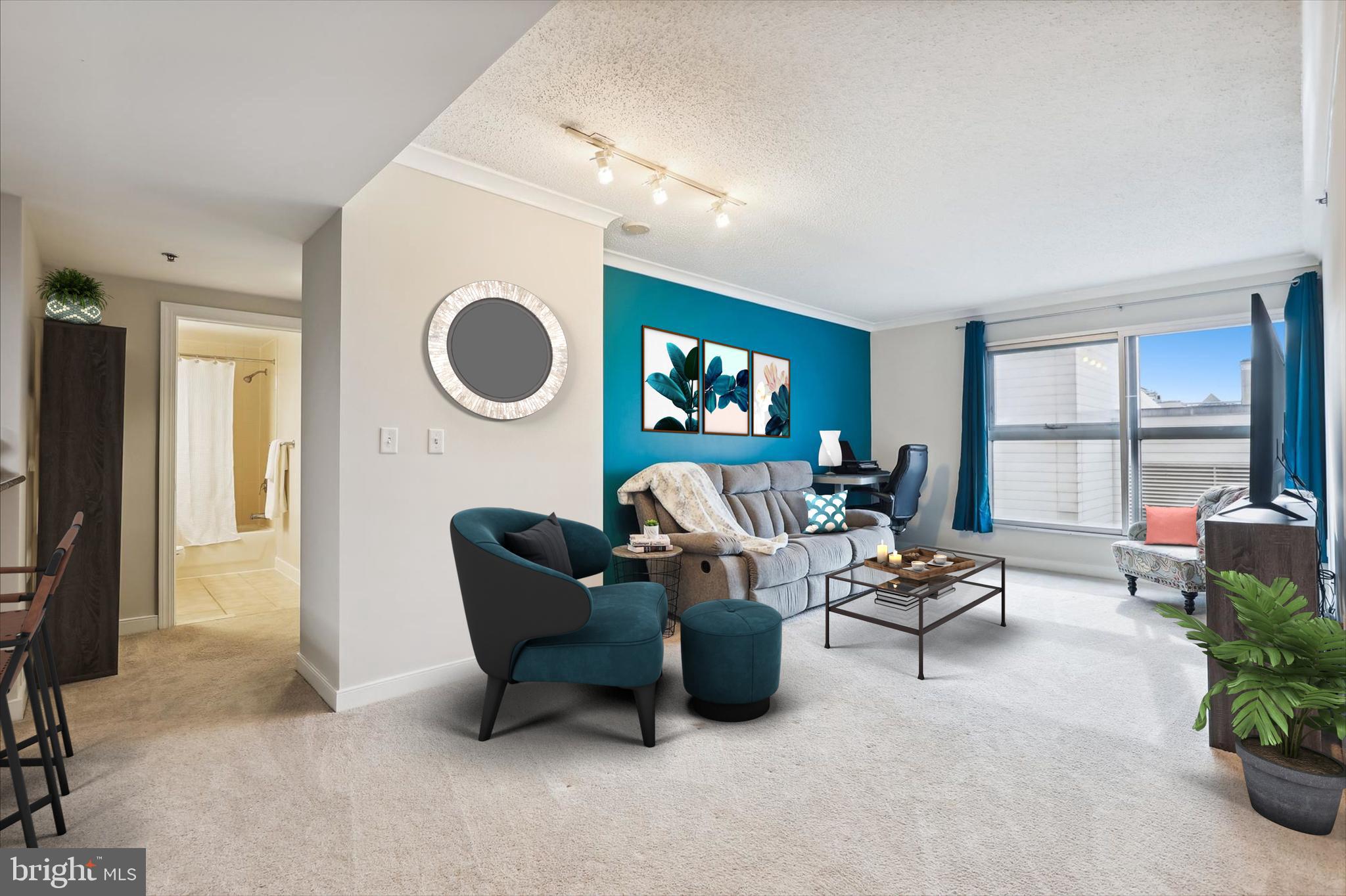 777 7th Street Northwest, Unit 804 Washington, DC 20001 - Photo 4 of 58 a living room with furniture and a large window
