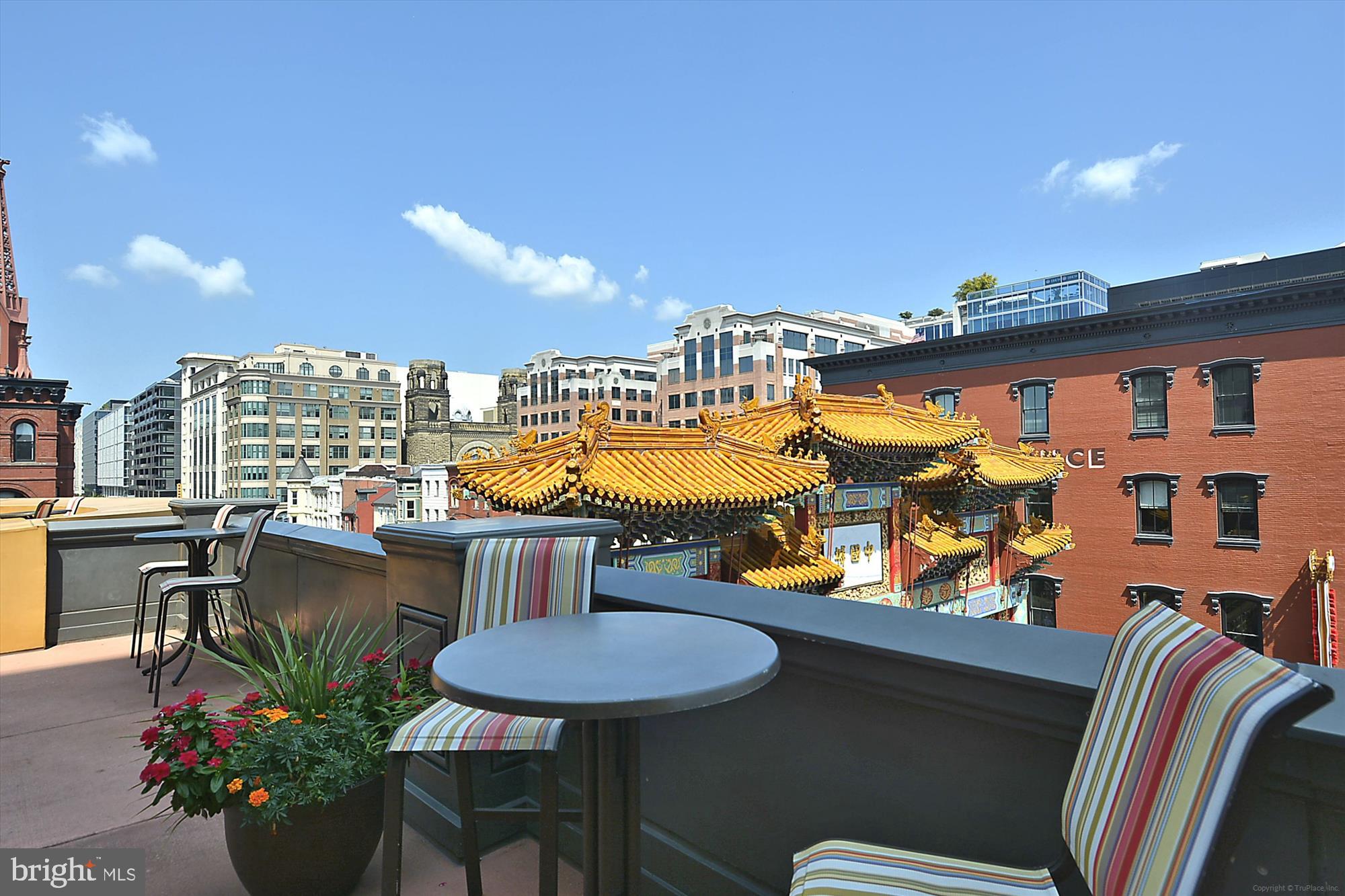 777 7th Street Northwest, Unit 804 Washington, DC 20001 - Photo 42 of 58 a balcony with table and chairs