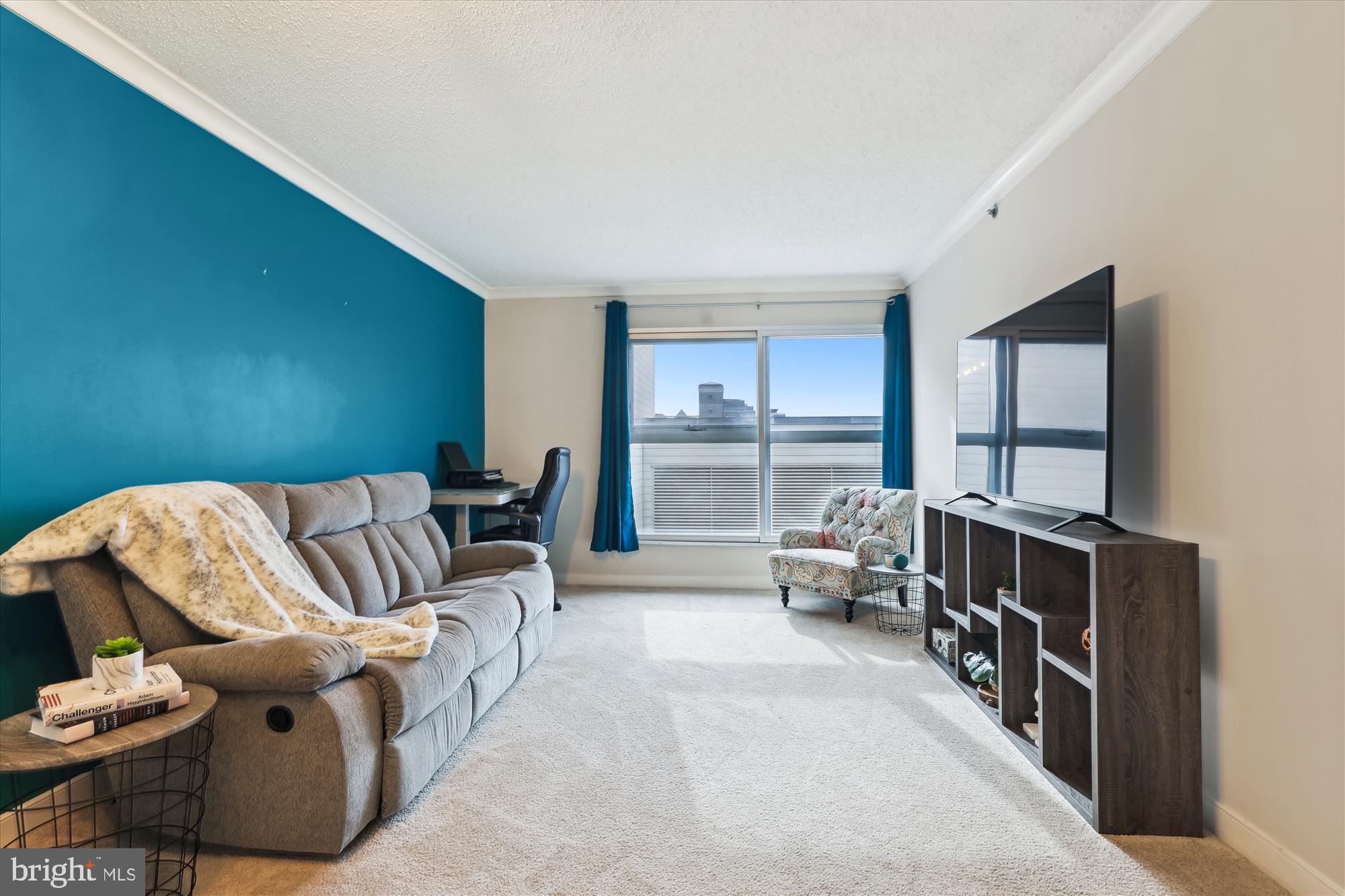 777 7th Street Northwest, Unit 804 Washington, DC 20001 - Photo 5 of 58 a living room with furniture and a large window