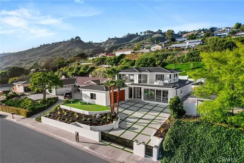 an aerial view of a house with a garden