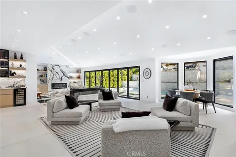 a kitchen with stainless steel appliances kitchen island granite countertop a sink and cabinets