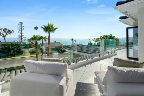 a view of a patio with a table and chairs