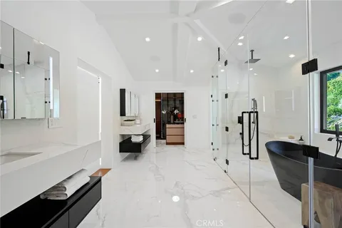 a bathroom with a shower and a bathtub