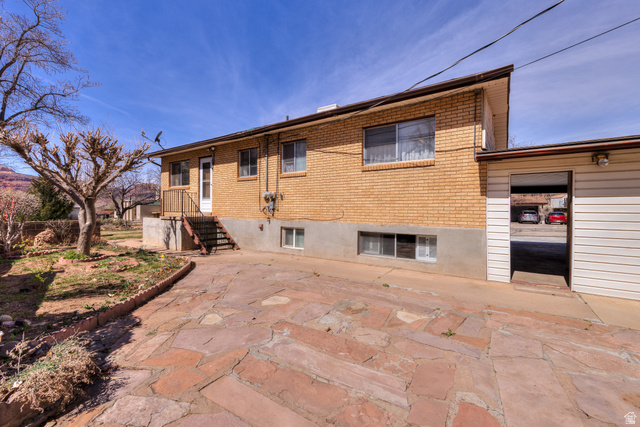 738 Locust Lane Moab, UT 84532 - Photo 22 of 25 Rear view of house with brick siding