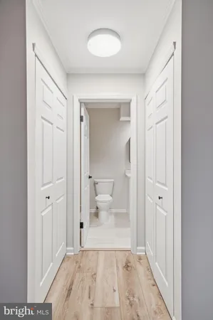 a view of a bathroom from a hallway