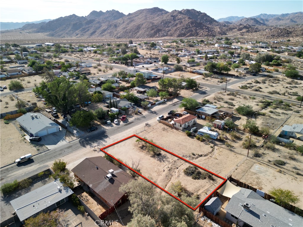 61998 El Reposo Circle Joshua Tree, CA 92252 - Photo 13 of 20 an aerial view of residential house and sandy dunes