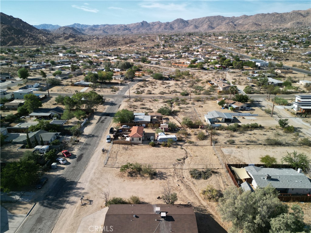 61998 El Reposo Circle Joshua Tree, CA 92252 - Photo 14 of 20 an aerial view of residential houses and outdoor space