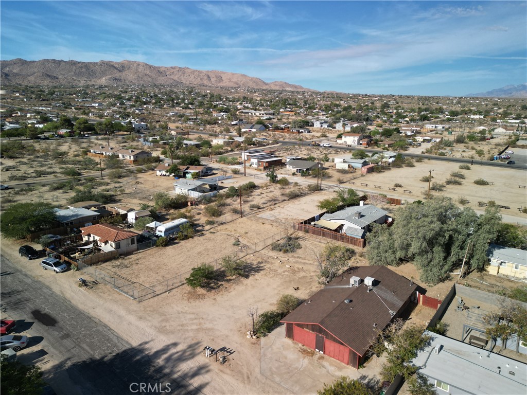 61998 El Reposo Circle Joshua Tree, CA 92252 - Photo 2 of 20 an aerial view of residential building with parking space