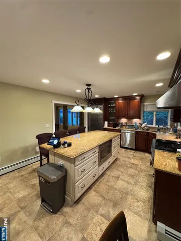 a kitchen with a stove and a refrigerator