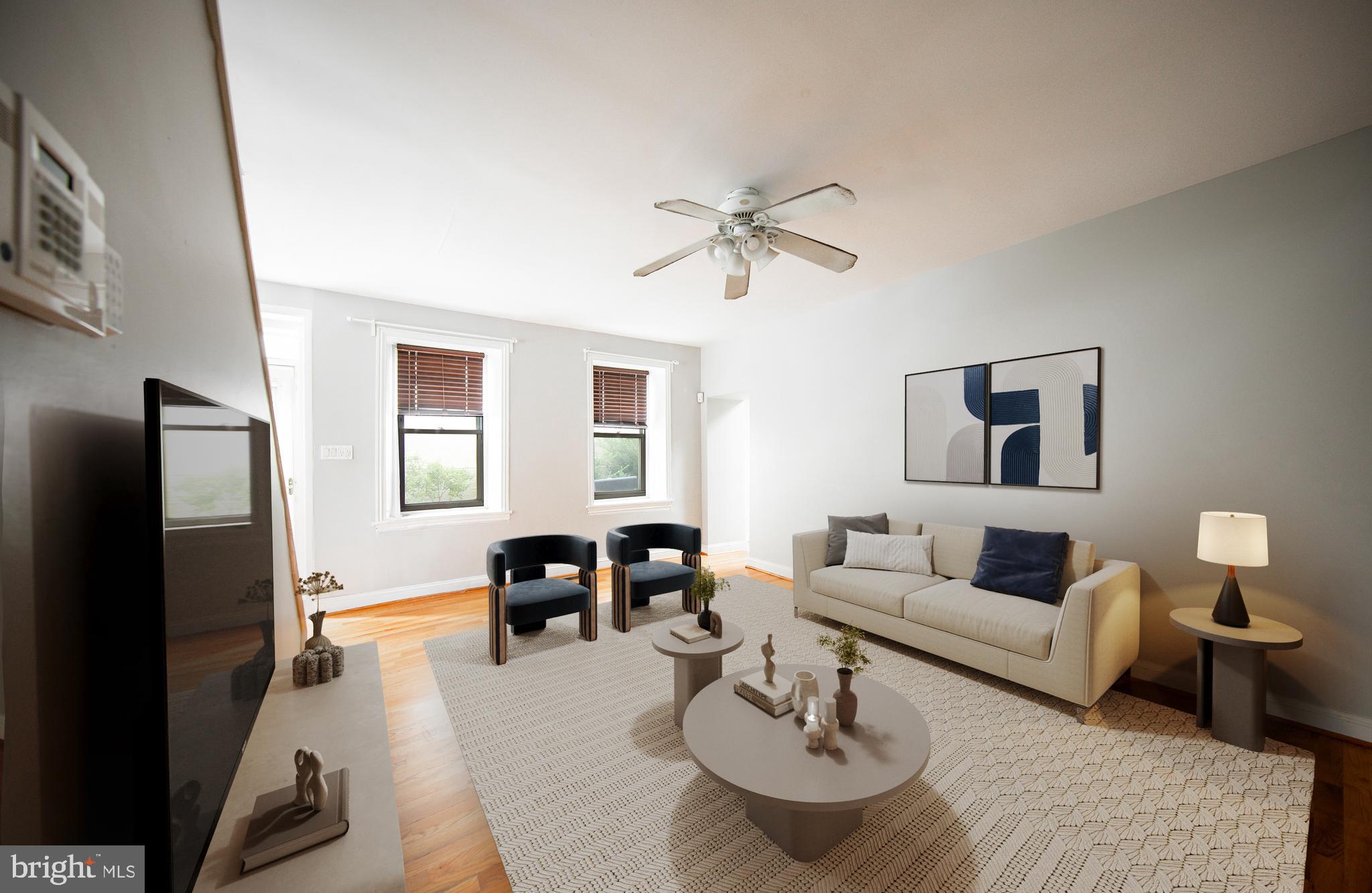 a living room with furniture and a flat screen tv