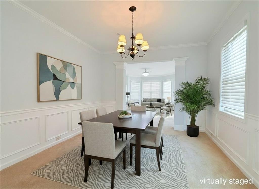 615 Ceremony Way Acworth, GA 30102 - Photo 3 of 8 a dining room with furniture potted plants and wooden floor