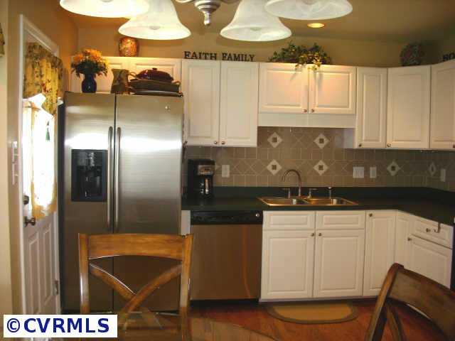 5012 Parrish Branch Road Midlothian, VA 23112 - Photo 5 of 8 Other - Stylish eat-in kitchen with custom tile back splash, stainless steel appliances, and pantry.