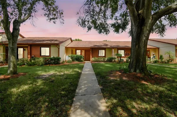 a front view of a house with yard