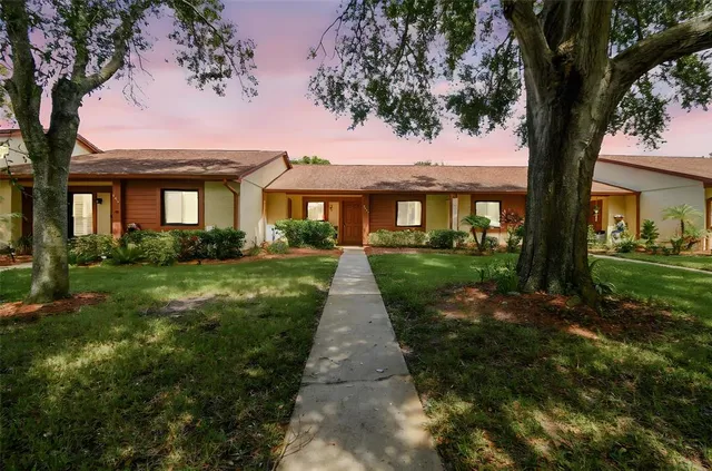 a front view of a house with yard