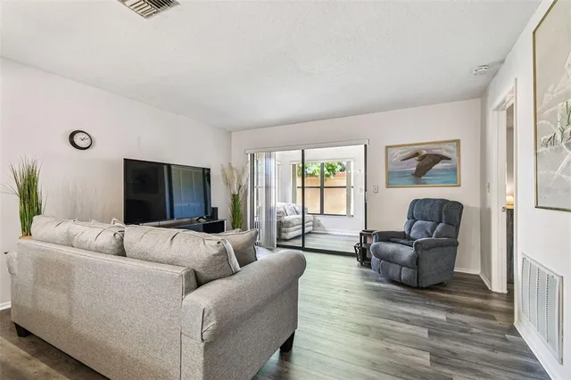 a view of walk in closet with clothes