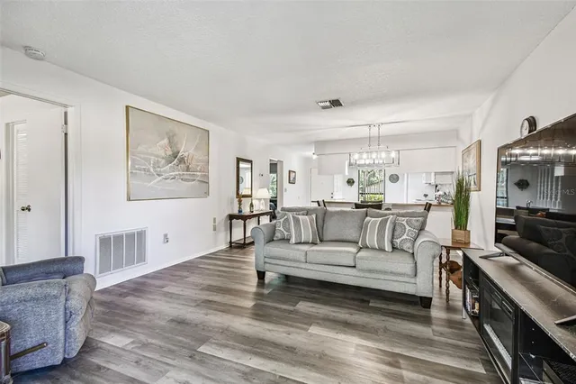 a en suite bathroom with a double vanity sink and a mirror
