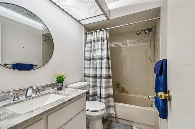 an aerial view of a residential houses with outdoor space and street view