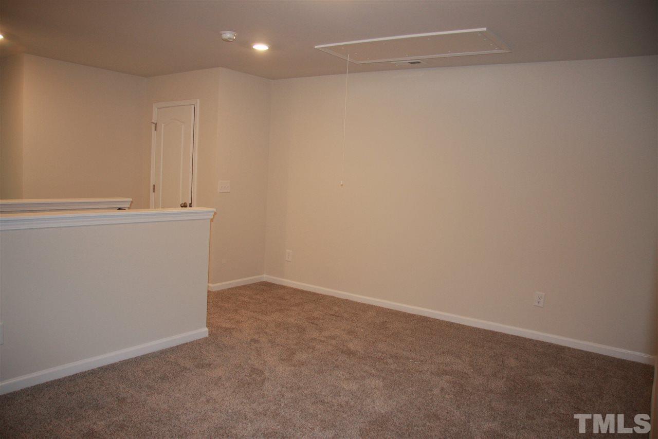 1154 Chestnut Bluff Apex, NC 27502 - Photo 14 of 26 a view of an empty room