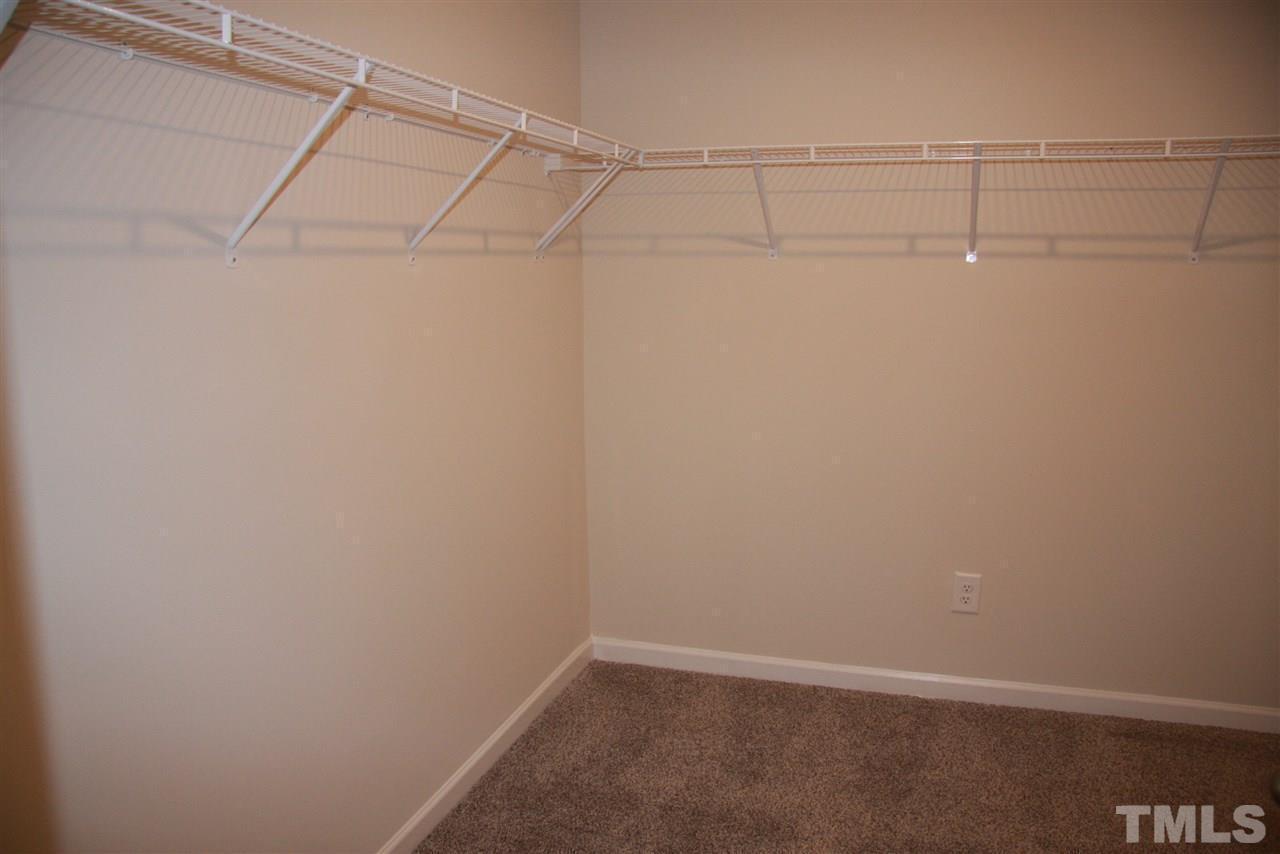 1154 Chestnut Bluff Apex, NC 27502 - Photo 21 of 26 a view of a room with racks on the wall