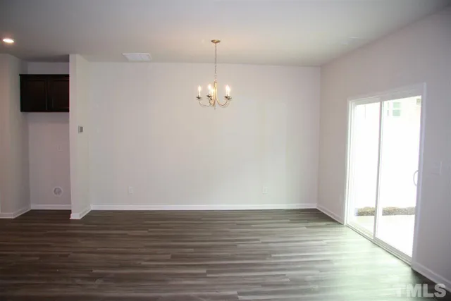 a view of a livingroom with wooden floor