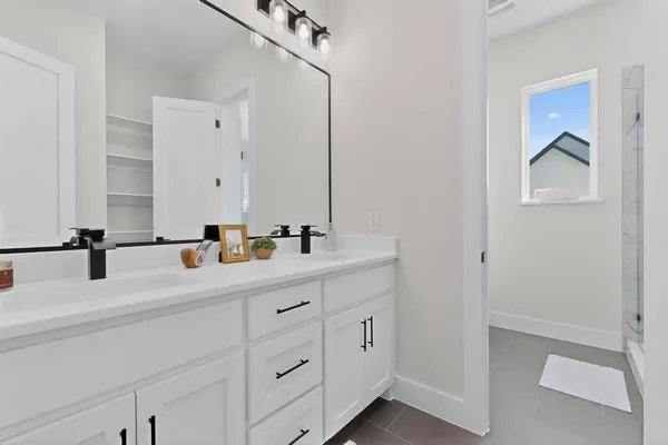 a bathroom with a shower and a shower