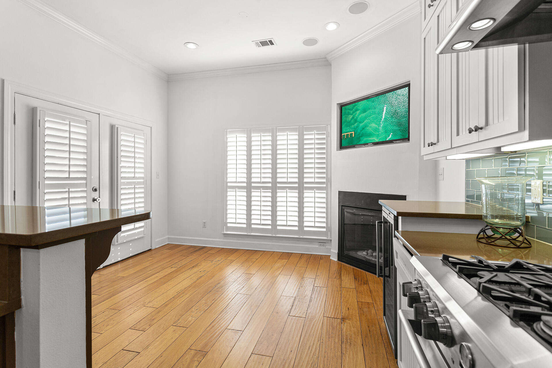 4460 Clipper Cove Destin, FL 32541 - Photo 12 of 37 a kitchen with wooden floors and a stove