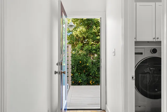 a view of a hallway with washer and dryer