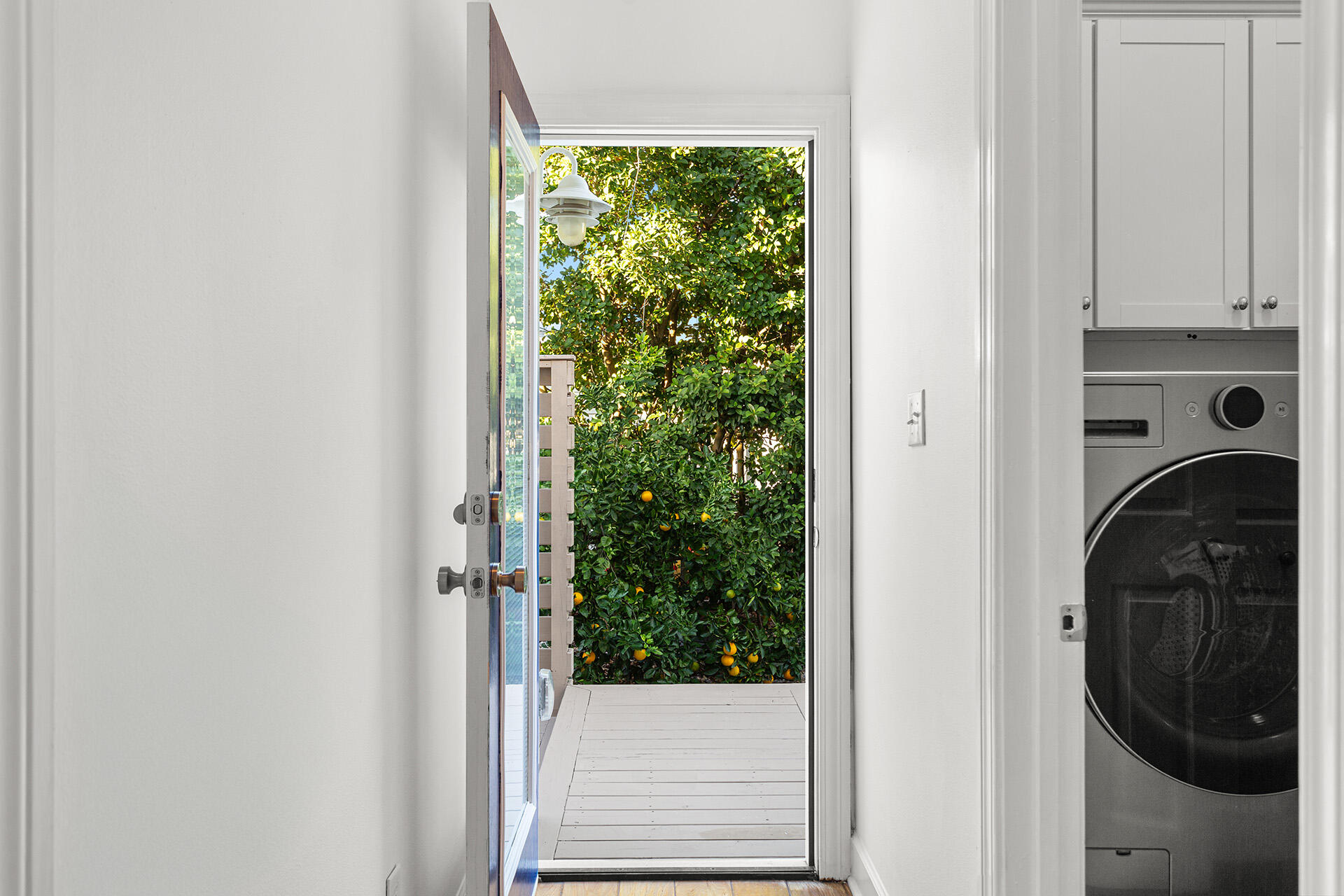 4460 Clipper Cove Destin, FL 32541 - Photo 19 of 37 a view of a hallway with washer and dryer