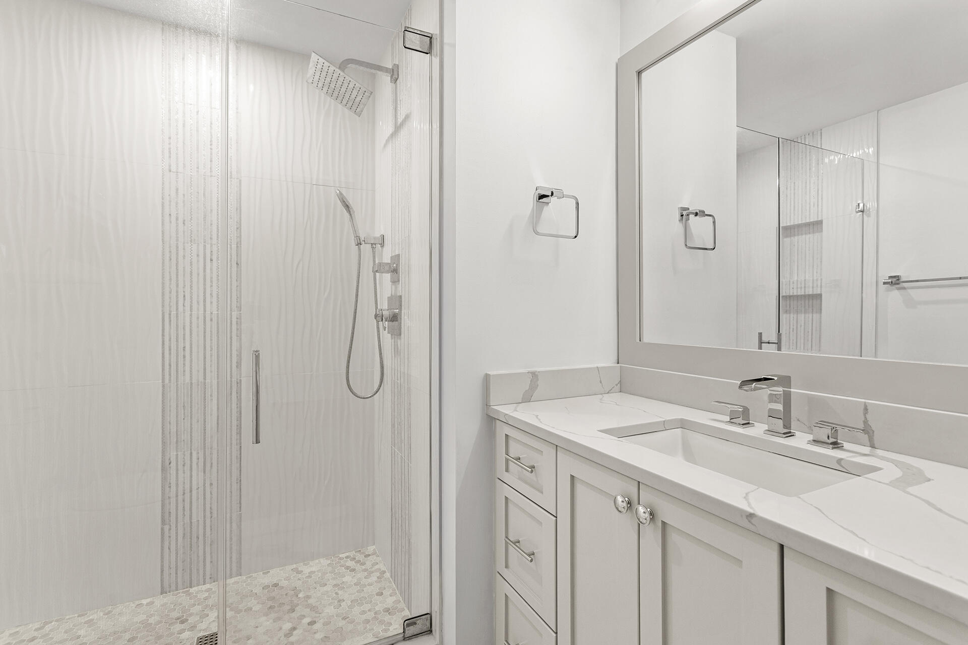 4460 Clipper Cove Destin, FL 32541 - Photo 28 of 37 a bathroom with a sink vanity granite shower and a mirror