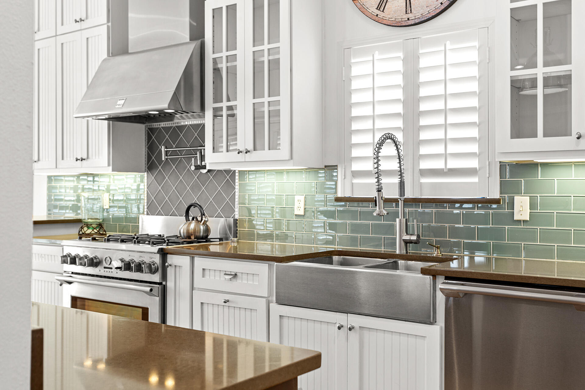4460 Clipper Cove Destin, FL 32541 - Photo 6 of 37 a kitchen with granite countertop a sink a stove and cabinets