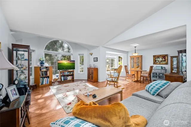 a living room with furniture fireplace and a flat screen tv